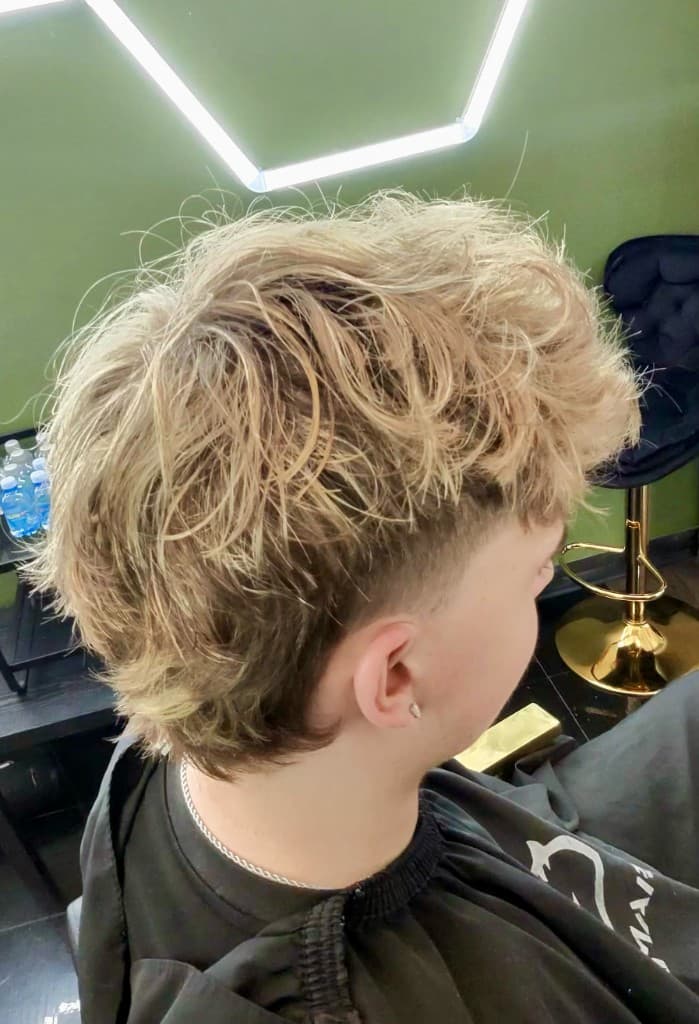 Blonde modern mullet with burst fade