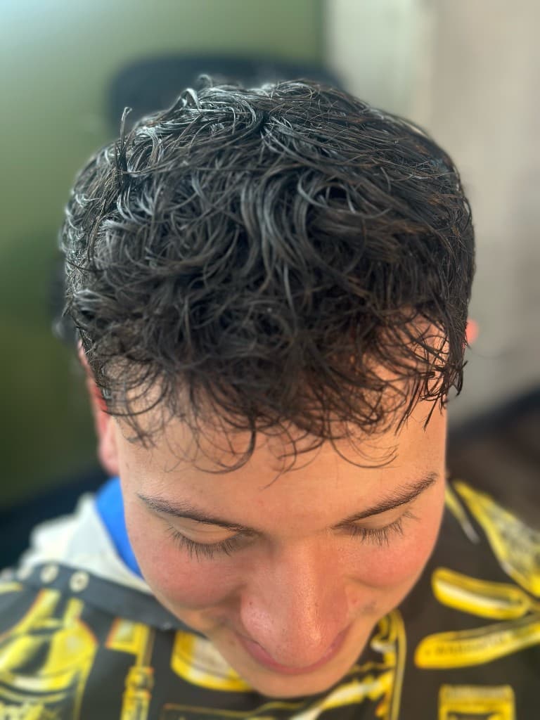 Curly textured style with wet look finish