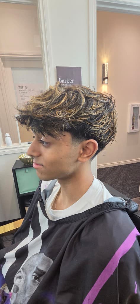Textured haircut with blonde highlights