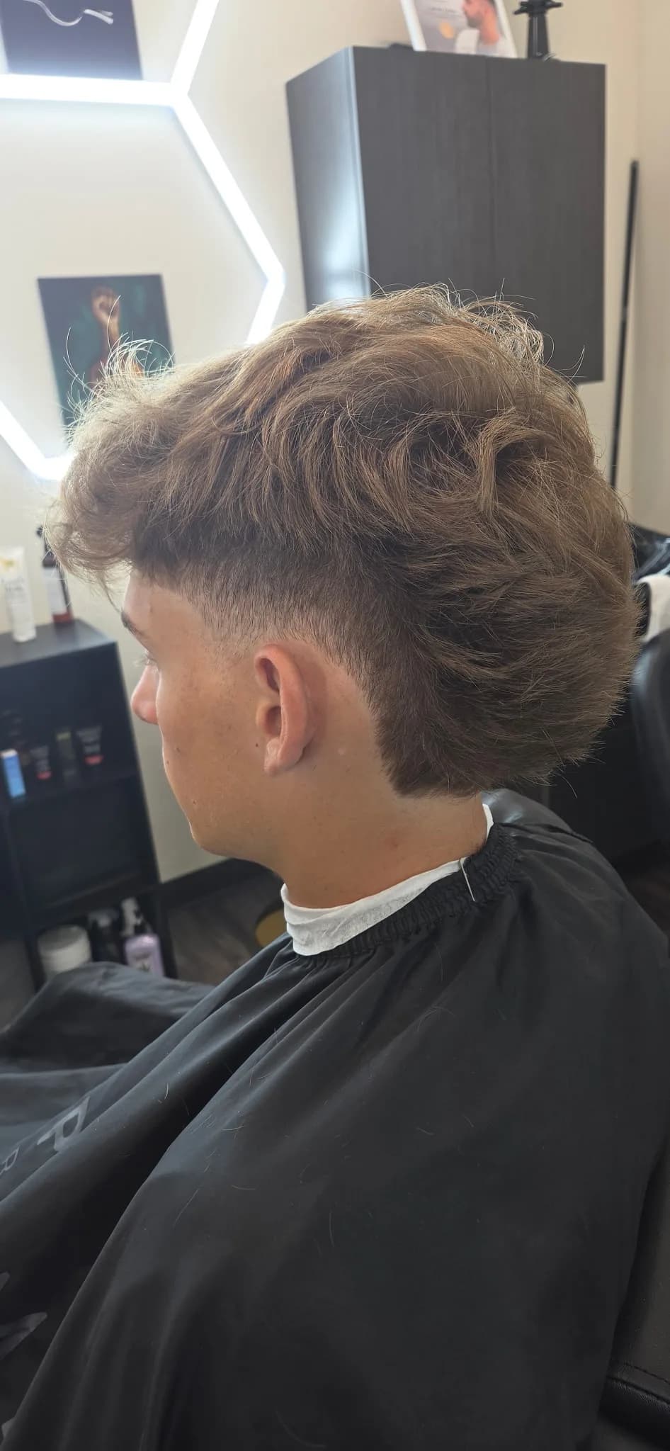 Textured modern mullet with a soft temple fade